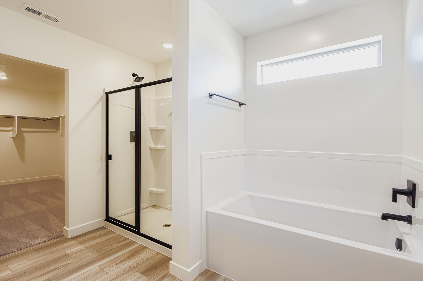 A bathroom with a glass shower.