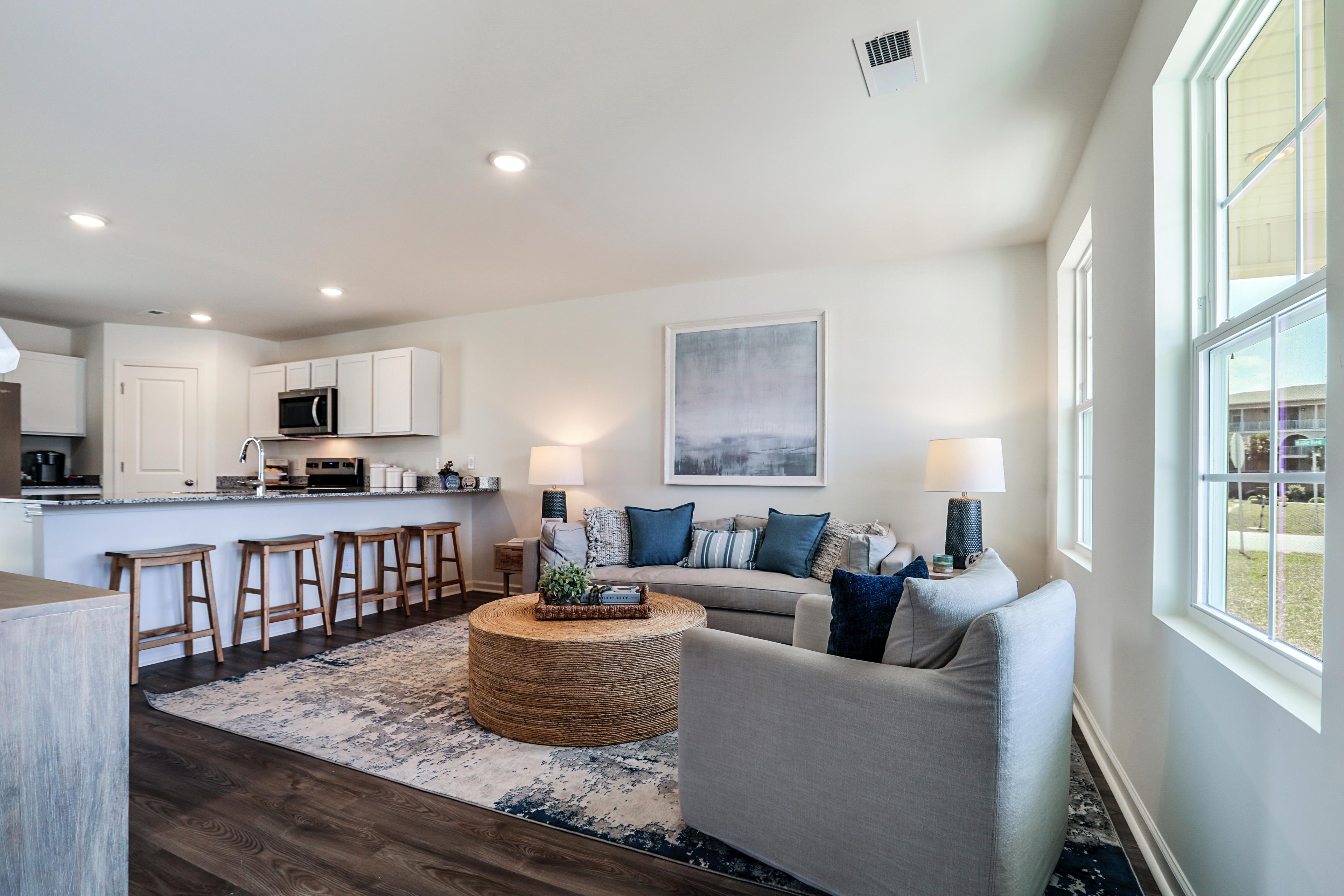 A living room with a couch and a table.