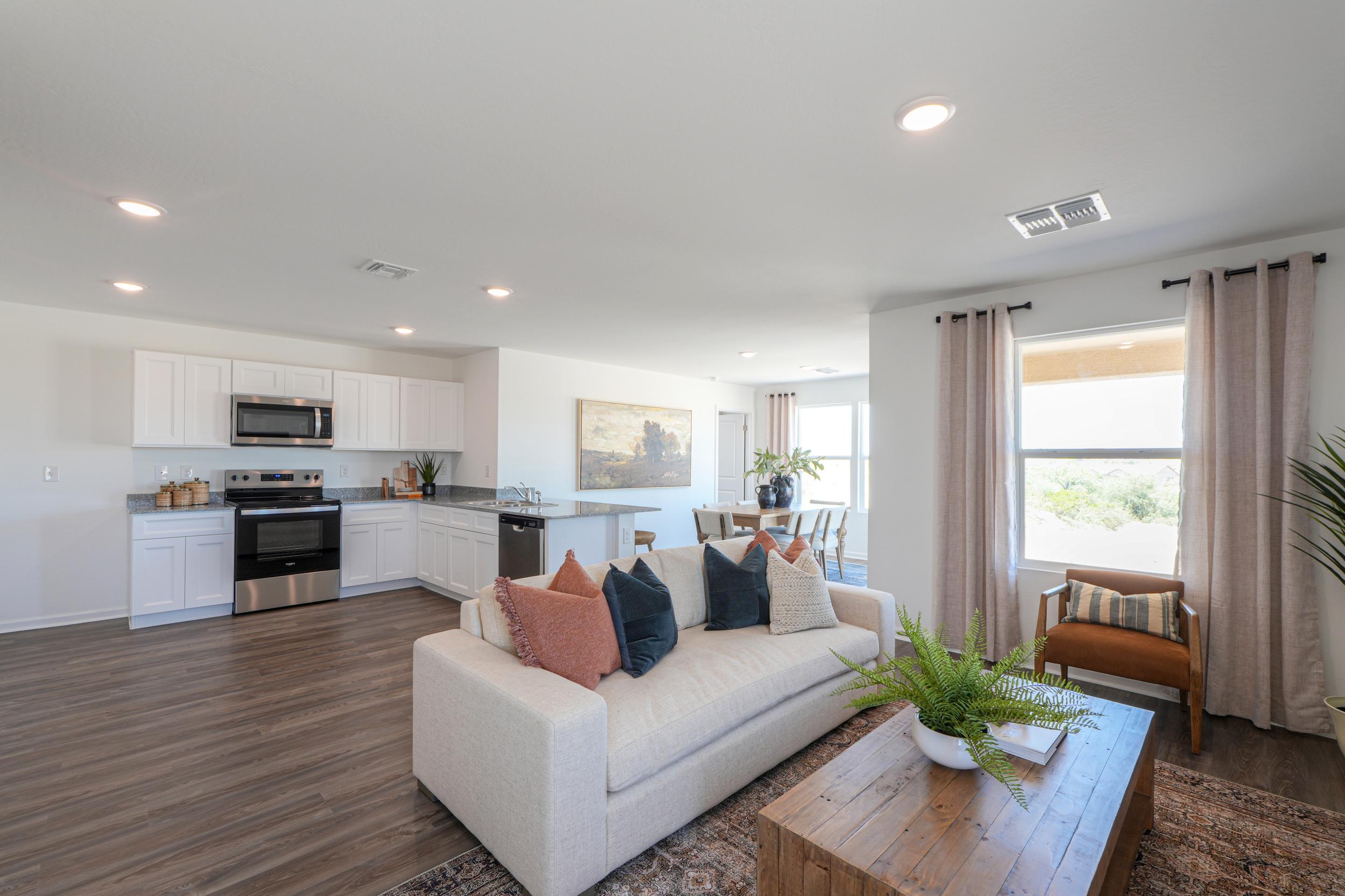 A living room with a couch and a table.