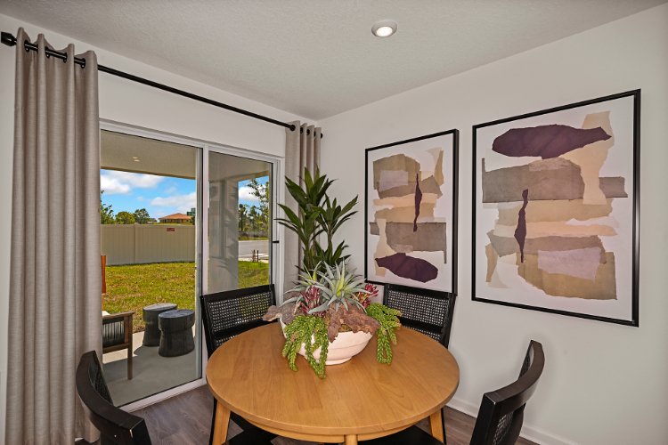 A room with a table and chairs.