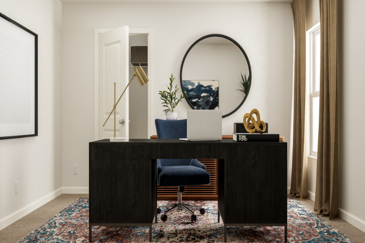 A desk with a mirror and a chair in a room.