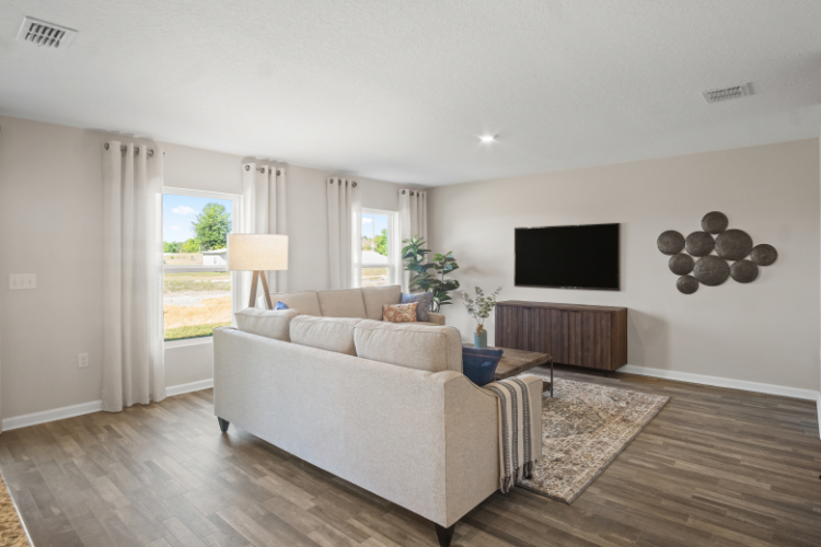 A living room with a white couch.