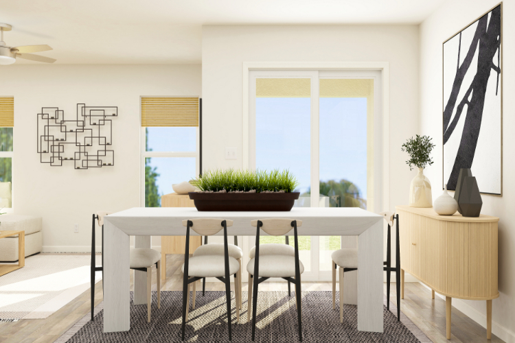 A dining room with a table and chairs.