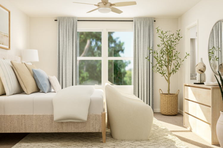 A living room with a couch and a fan.