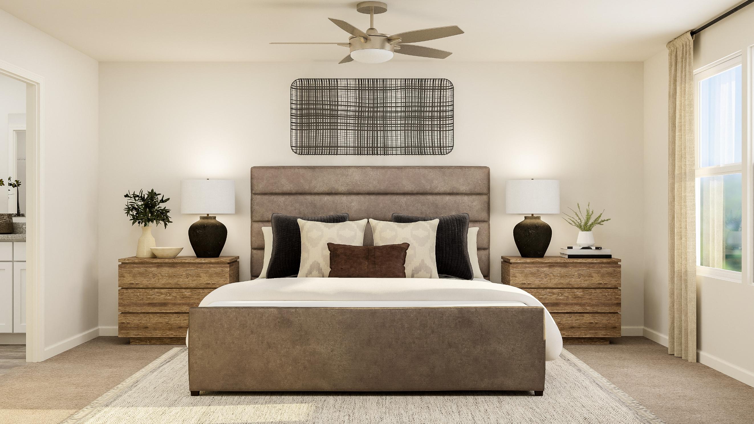 A bedroom with a bed and a fan.