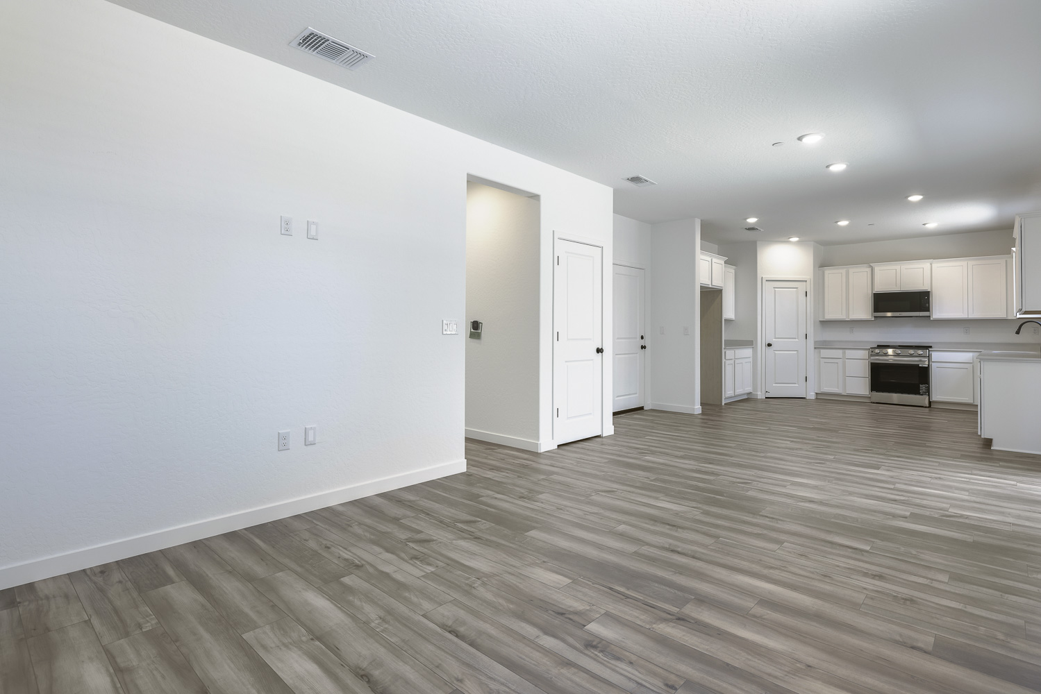 A large empty room with white walls.