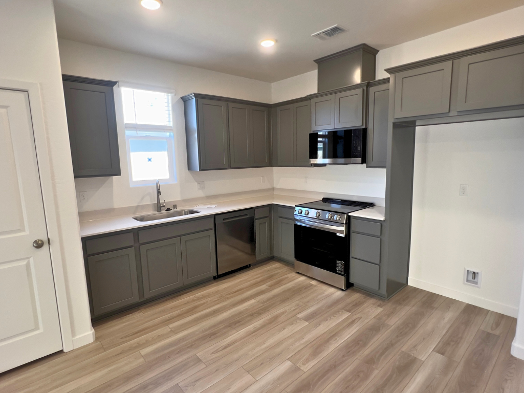 A kitchen with black appliances.